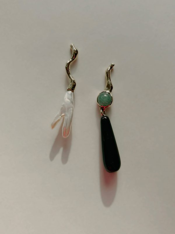 Mismatched pearly earrings